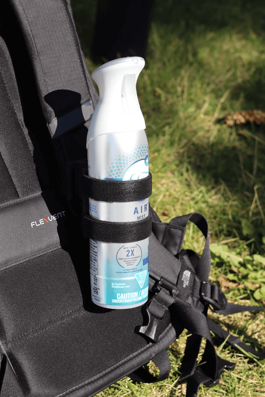 Side view of prototype mounted on backpack shoulder strap outdoors