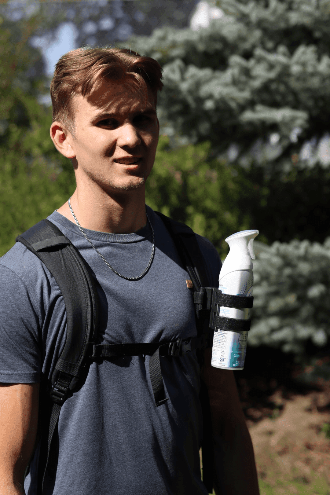 Wearing prototype on backpack with canister at chest height for fast access