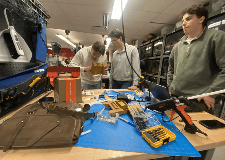 Team assembling printed hull sections in the makerspace