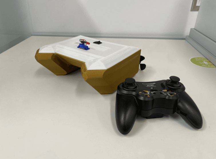 Completed twin-hull prototype with Bluetooth controller on the desk
