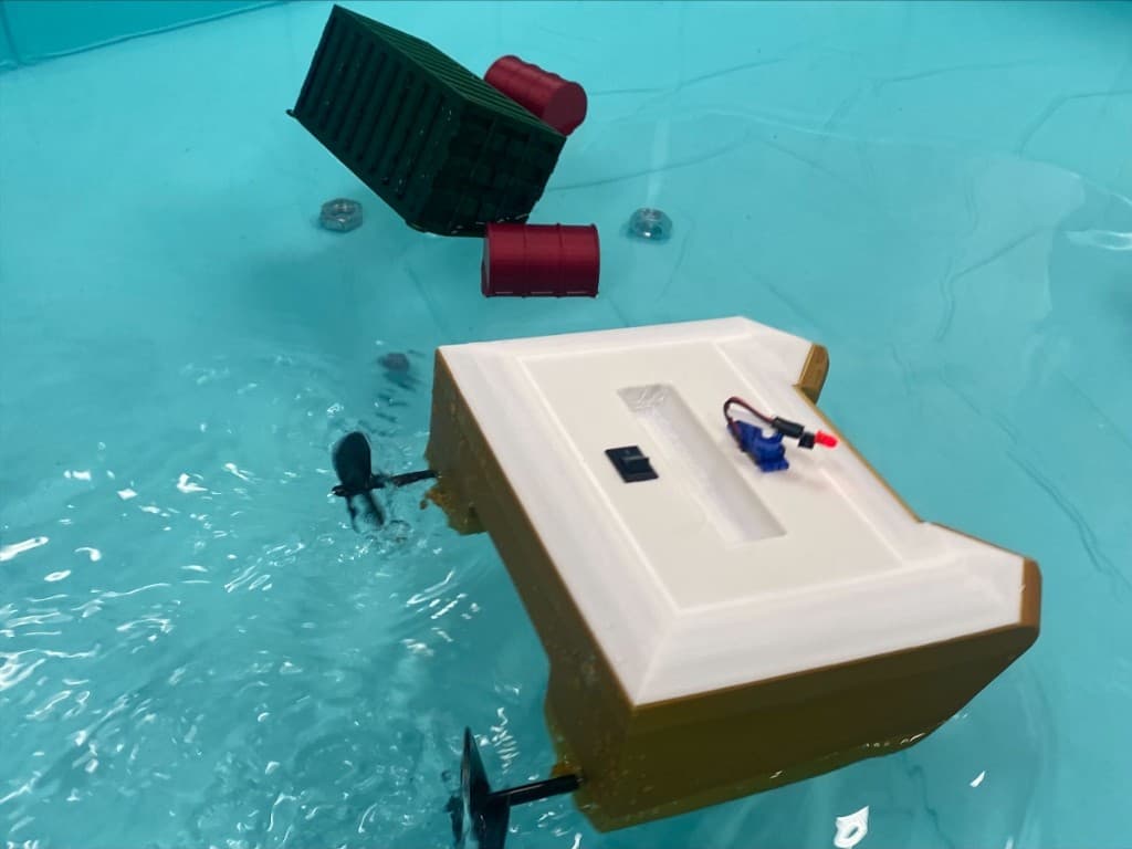 Finished vessel navigating around obstacles in a test pool